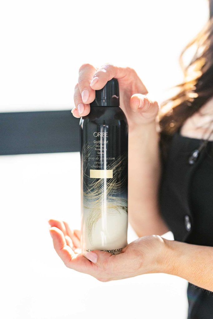 Bronde Blvd Salon Hair Stylist Holding ORIBE Product